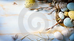 Easter background with Easter eggs and spring flowers. Top view