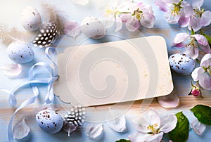 Easter background with Easter eggs and spring flowers. Top view