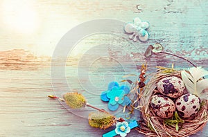 Easter background with Easter eggs and spring flowers. Top view with copy space