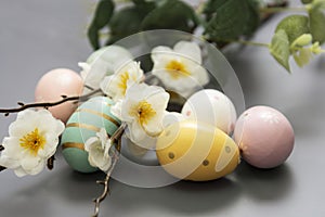 Easter background with eggs and branch with flowers