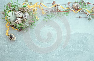 Easter background with Easter eggs and spring flowers. Top view with copy space