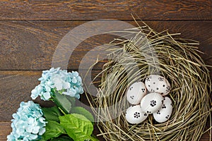 Easter background.Happy easter eggs pained on nest also photo
