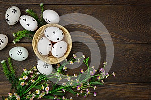 Easter background. Happy easter eggs pained on wood bask photo