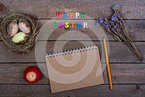 Easter background. The inscription of the multicolored wooden letters `Happy Easter`.