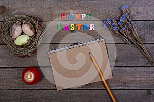 Easter background. The inscription of the multicolored wooden letters `Happy Easter`.