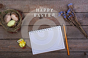 Easter background. The inscription of the wooden letters `Happy Easter`.