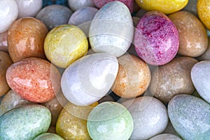 Easter background, natural marble eggs, different colors, Colorful background of onyx marble stone eggs