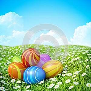 Easter Background with ornate Easter eggs on meadow.