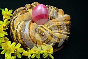 Easter baking. Easter wreath.A wreath with an easter egg in the middle and narcissi daffodil