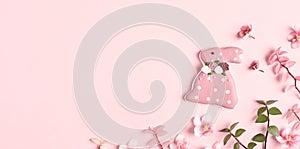 Easter banner, Easter decorations, pink bunny, flowers and copy space.