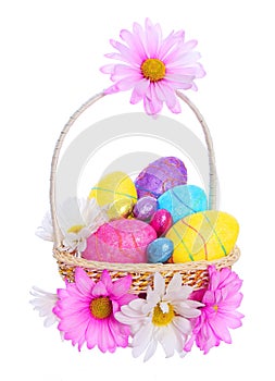 Easter Basket with Colorful Eggs and Chamomile Flo