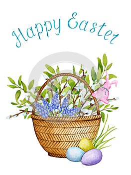 Easter basket decorated with willow branches, flowers, young foliage, Easter eggs
