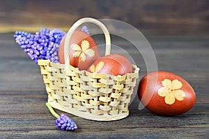 Easter basket. Easter eggs and spring flowers
