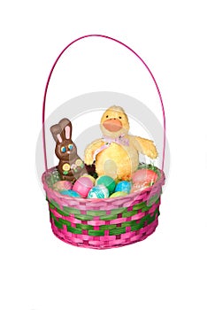 Easter basket with eggs and candy