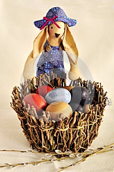 Easter. Basket with eggs and a toy rabbit