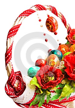 Easter basket with poppies and eggs isolated on white