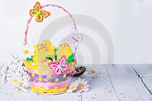 Easter basket with yellow chicks. Cute Easter concept.