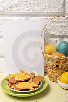 Easter blank vertical card with basket with colored eggs