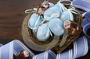 Easter blue decoration eggs in birds nest