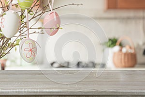 Easter. Blurred kitchen and wooden tabletop with space for display your product