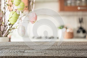 Easter. Blurred kitchen and wooden tabletop with space for display your product