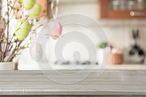 Easter. Blurred kitchen and wooden tabletop with space for display your product