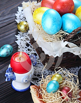 Easter bread and colorful eggs on a wooden, white background.