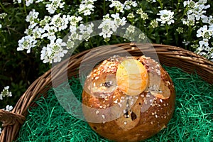 Easter bread in front of beautiful spring flowers