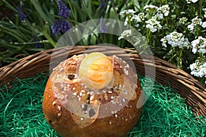 Easter bread in front of beautiful spring flowers