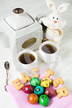 Easter breakfast with color quail eggs and word `Easter` of cook