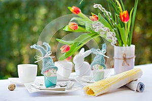 Easter breakfast with eggs and dekoration on a white table