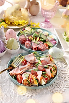 Easter breakfast with fresh salads and ham cones filled with eggs and vegetables