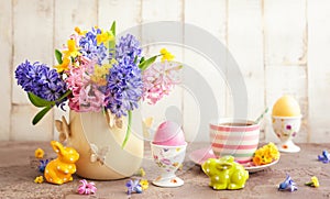 Easter breakfast table with flowers and Easter decor