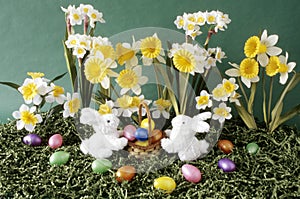 Easter bunnies with flowers and basket