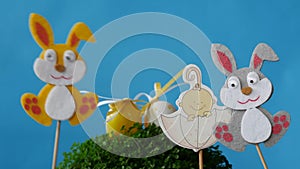 The Easter bunnies found Easter eggs and baby in umbrella
