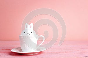 Easter bunnny-cup on a pink background.