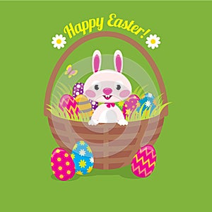 Easter bunny in a basket with Easter eggs on a green background