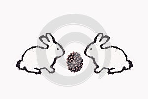 Easter bunny from coffee ground with cup on a white background