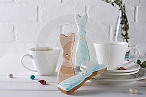 Easter bunny cookies and cup of tea. Celebration breakfast table setting.