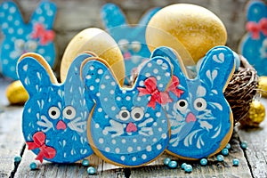 Easter bunny cookies, homemade painted gingerbread biscuits in glaze shaped funny rabbits