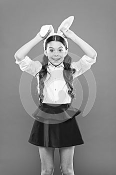 Easter bunny costume. funny little girl in rabbit ears. happy childhood. Cheerful kid celebrate easter holiday. spring