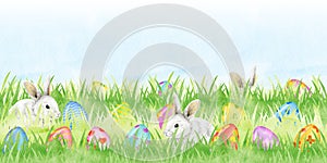 Easter Bunny with Easter Eggs in Green Fresh Grass. Watercolor illustration