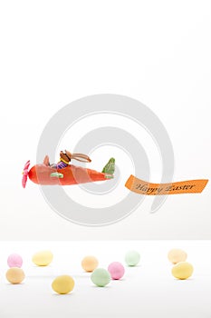 Easter bunny flying in a Carrot-airplane