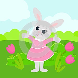 Easter bunny girl in a pink dress. The animal is in a green meadow.
