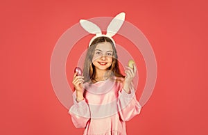 Easter bunny hold painted eggs. happy easter. smiling kid in rabbit ears. Egg hunt on spring holiday. Holiday