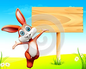 Easter bunny jumping before wooden sign