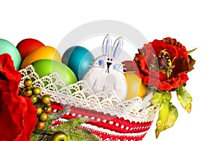 Easter bunny with poppies and colourful eggs isolated on white