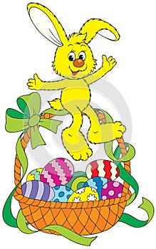 Easter bunny sitting on a basket