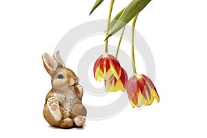Easter bunny and spring tulips on a light background