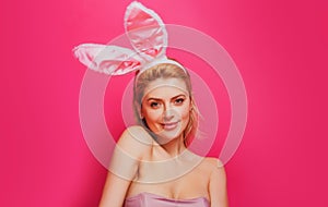 Easter bunny woman. Studio shot of a young woman wearing bunny ears.